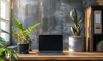 A stylish home office setup with a blank screen laptop and modern decor photo