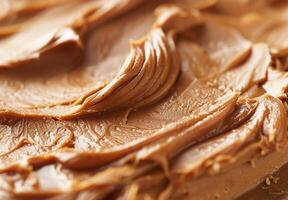 High-detail close-up of the smooth and creamy texture of peanut butter photo