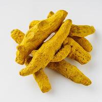 aromatic turmeric root on a white acrylic background photo