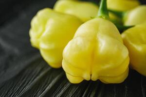 fresh delicious chili pepper aji white fantasy on a dark wooden rustic background photo