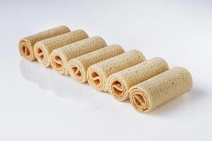 crispy dessert wafer rolls on a white background photo