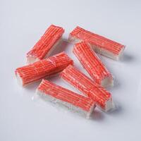 fresh chilled surimi crab sticks on a white background photo
