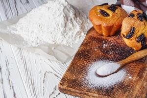 muffins baked with the addition of ammonium carbonate on a wooden rustic background photo
