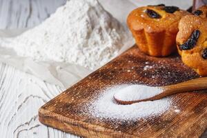 muffins baked with the addition of ammonium carbonate on a wooden rustic background photo