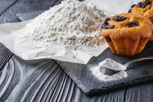 muffins baked with baking powder on a black wooden rustic background photo