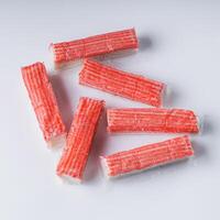 fresh chilled surimi crab sticks on a white background photo
