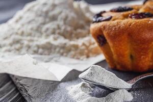 muffins baked with baking powder on a black wooden rustic background photo