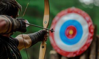 An archer's body aiming a bow, with the target in the background photo
