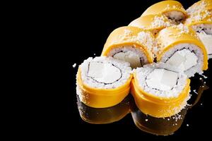 sushi roll with American cheese tofu and Philadelphia on a black mirror background photo
