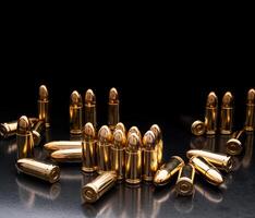 Bullet isolated on black background with reflexion. Rifle bullets close-up on black back. Cartridges for rifle and carbine on a black. photo