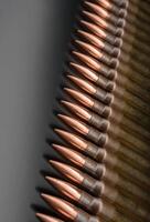 Rifle bullets close-up on black back. Cartridges for rifle and carbine on a black. Bullet isolated on black background with reflexion. photo