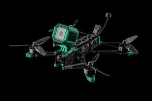 Modern FPV drone. Four-engine aircraft on the radio control. Drone for racing, filming and entertainment. photo