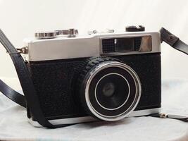 old vintage camera gear on white background. top view, flat lay. Retro vintage concept. Travel and journey design element photo