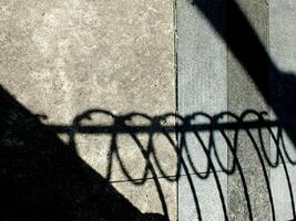 abstract background textured of a random shadow on an pavement pedestrian. photo