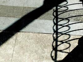 abstract background textured of a random shadow on an pavement pedestrian. photo
