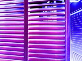 abstract background neon purple light striped window. futuristic design wallpaper, copy space for text photo