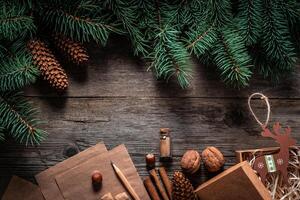 Christmas green frame from fir branches on a vintage gray board background. Frame of fir branches. Christmas card blank. photo