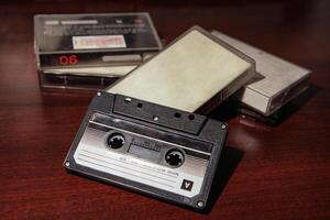 Close-up of an audio cassette with a sticker without text. Analog storage medium. Cassettes for audio recordings and music. photo