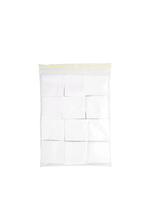 Patches for cleaning weapons isolate on a white background. White square scraps of fabric stacked in piles. photo