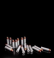 Bullet isolated on black background with reflexion. Rifle bullets close-up on black back. Cartridges for rifle and carbine on a black. photo