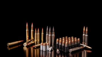 Bullet isolated on black background with reflexion. Rifle bullets close-up on black back. Cartridges for rifle and carbine on a black. photo