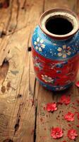 Blue and Red Vase on Wooden Table photo