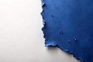 Grey ripped wet paper at white background for your presentation background photo