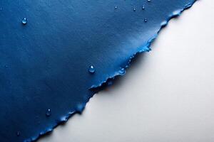 Grey ripped wet paper at white background for your presentation background photo