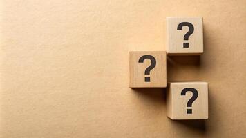 Beige background with question wood mark for your presentation background photo