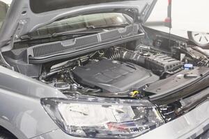 Car with open hood at a service station photo