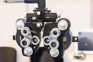 Phoropter used for eye examination to measure refractive error to determine eyeglass prescriptions photo