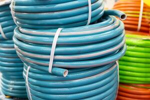 Coils with multi-colored rubber hoses on a store window photo