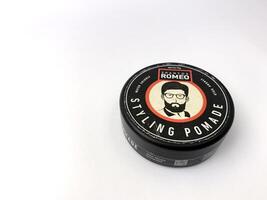 a can of romeo styling pomade on a white surface. Indonesia, Sibolga, 10 August 2024. photo