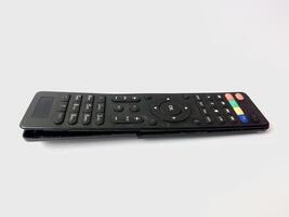 a broken tv remote on a white background. photo