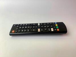 a tv remote on a white background. photo