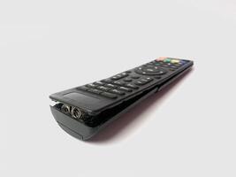 a broken tv remote on a white background. photo
