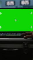 Vertical Military agent working in control room, using isolated screen software on laptop, analyzing aerial reconnaissance data. Intelligence corps expert controlling drones with mockup notebook, camera A video