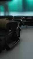 Vertical Extreme close up of weapons in empty army command center housing operational defense systems. Guns on table in armed forces headquarters used for tracking rockets using radar systems video