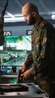 Vertical Operatives conducing special operation, loading weapons, preparing to attack enemy forces. Close up of army soldier in command center packing guns for assault mission, camera B video