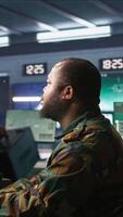 Vertical Soldier doing tasks in military base, using radar, intercepting and destroying ballistic rockets. Man monitoring army HQ CCTV for any unauthorized activity, tracking missiles, camera B video