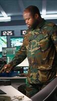 Vertical Intelligence corps expert in military HQ base gathering information on enemy troops. Officer arriving at work in base of operations, starting assessment of enemy vulnerabilities, tracking, camera B video