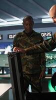 Vertical Army soldiers packing weapons able to engage targets at extended range with accurate, lethal fire. Military units loading guns with bullets, preparing for enemy suppression mission, camera B video