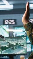 Vertical Terrorist threatening soldiers with rifles in command post. Insurgent using guns to control hostages during enemy base assault hijacking in guerilla warfare armed conflict, camera A video