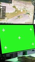 Vertical Military agent working in control room, using software on green screen devices, analyzing aerial reconnaissance data. Intelligence corps expert controlling drones with chroma key systems, camera B video