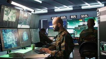 Army computer scientist employing AI technology in military planning and decision making processes. Expert uses artificial intelligence to enhance armed forces operational capabilities, camera B video