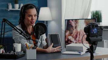 Famous social media star doing unboxing of modern smartphone. Creative digital content creator presenting touchscreen mobile device to audience while reviewing specifications. video