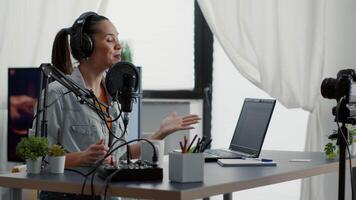 Excited famous internet live show host ending broadcast while sending air kisses to audience. Popular internet star saying goodbye to public while sitting at home studio desk. video