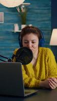 Vertical . Blogger speaking with followers on live podcast using headphones. Creative online show On-air production internet broadcast host streaming live content, recording digital social media communication video
