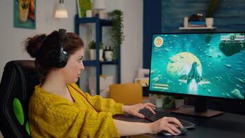 Professional esport woman gamer smiling at camera while compete in game playing on a championship event. Online streaming cyber performing on powerful personal computer during gaming tournament video