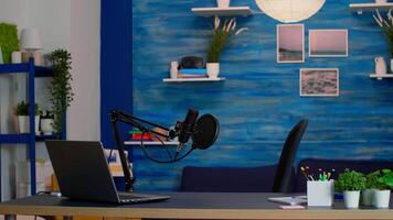 Empty professional setup for recording podcast in home studio of vlogger. Influencer recording social media content with production microphone, digital web internet streaming station video